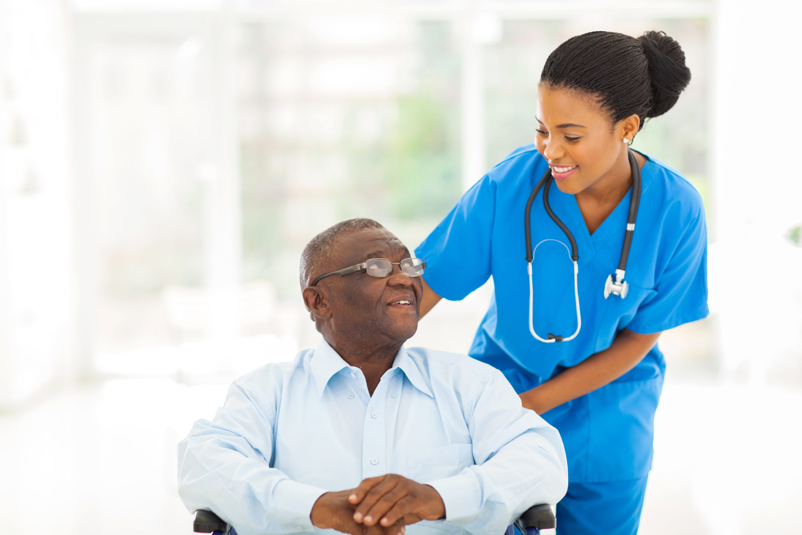 A shot of a black nurse caring for a senior patient in a wheelchair. Cannabis use among older adults is quickly growing in popularity.