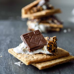 incredibles Smores Bar stacked on top of a marshmallow and graham cracker