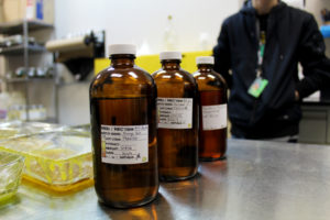 Three jars of terpenes resting on a counter at the Clear Creek Extracts lab in Evergreen, Colorado.